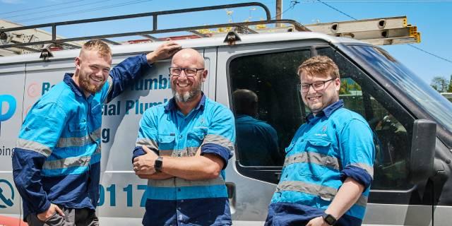 Smiling men with van